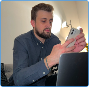 A picture of George with a laptop